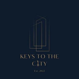 Keys to the City logo featuring geometric building outlines in gold on dark background, established 2022
